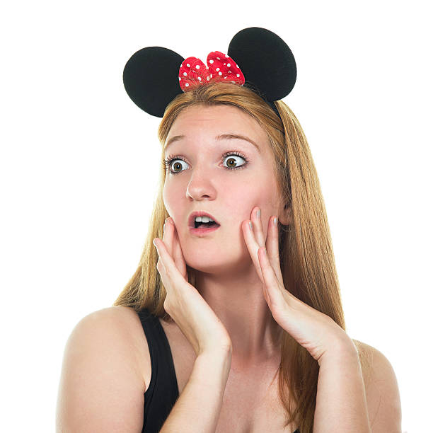 istock Surprised young woman with mouse ears. 500238549