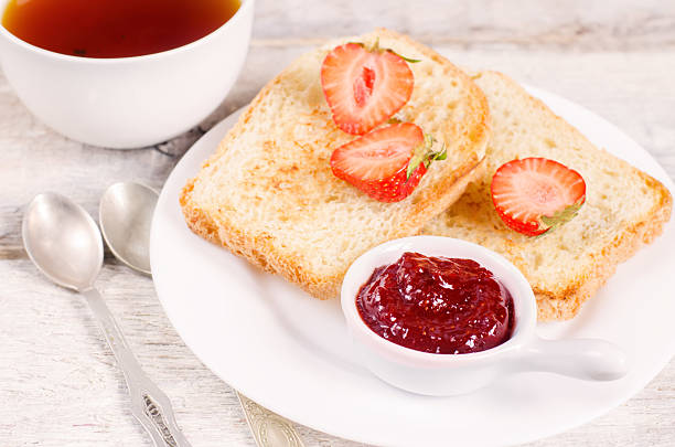 istock breakfast with fresh toasts, strawberries and strawberry jam 500239359