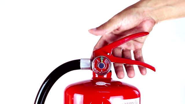 Man grabs a fire extinguisher