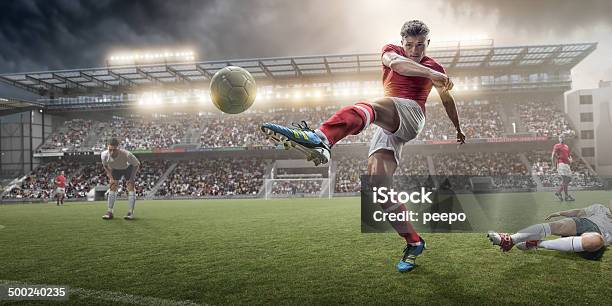 Soccer Player Kicking Ball Stock Photo - Download Image Now - Soccer, Soccer Player, Soccer Ball