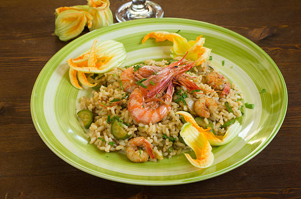 Risotto with shrimps and zucchini stock photo