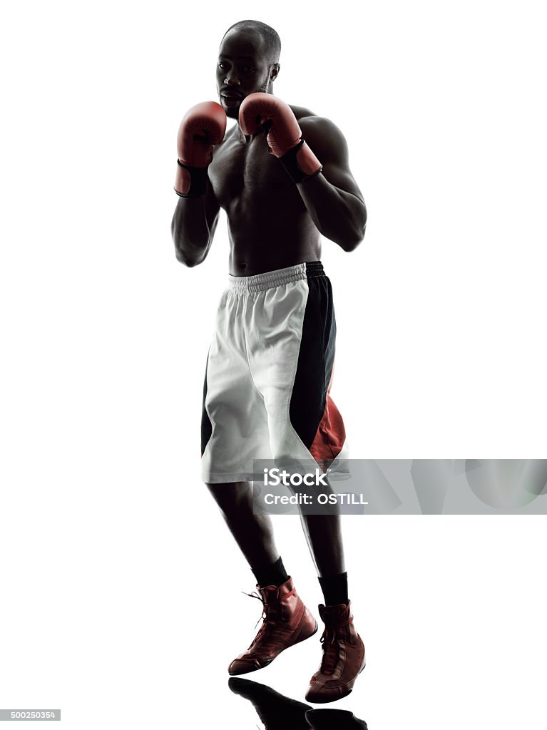 man boxers boxing isolated silhouette one man boxers boxing on isolated silhouette white background Boxing - Sport Stock Photo