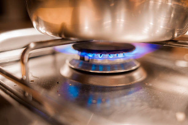 istock fire on a burner of a modern kitchen 500251670