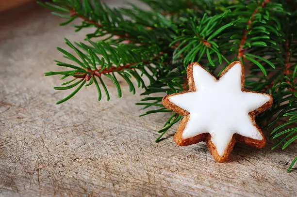 cinnamon star biscuit over wooden texture