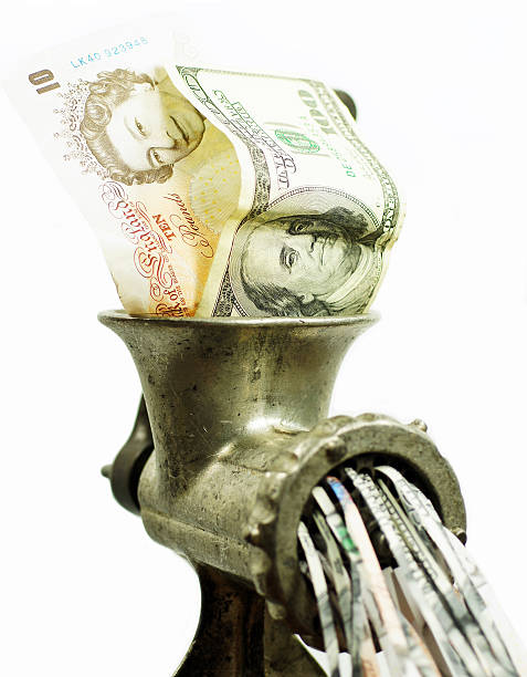 istock Pound and dollar bills in the meat grinder 500253798