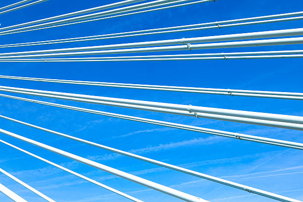 istock pattern of steel wires of a bridge under blue sky 500256033