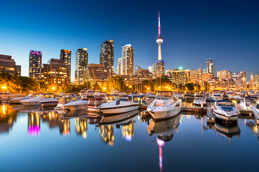 City skyline view of CN Tower in Toronto, Ontario, Canada from the marina along Lake Ontario