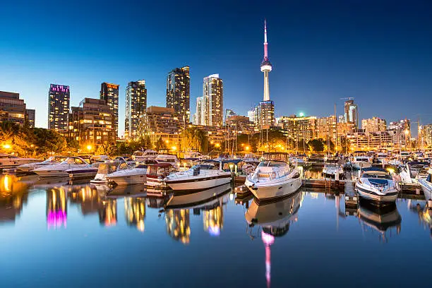 City skyline view of CN Tower in Toronto, Ontario, Canada from the marina along Lake Ontario