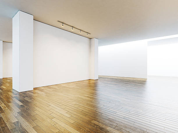 istock White canvas in museum interior with wooden floor. 3d render 500257530
