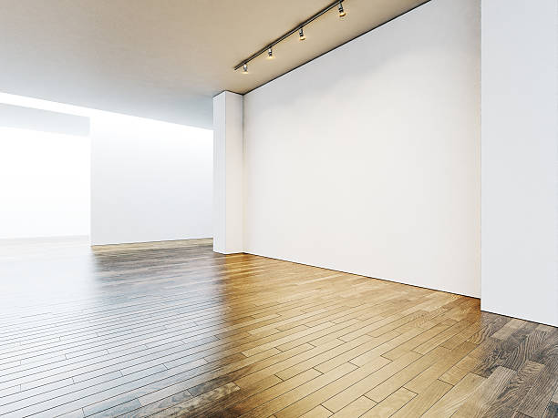 istock White gallery interior with empty walls and wooden floor. 3d 500257608