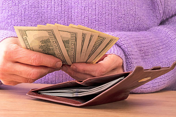 istock Woman with dollars 500257788