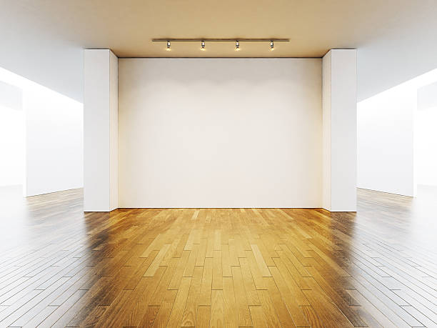 istock View on the blank wall in gallery with wooden floor 500257838