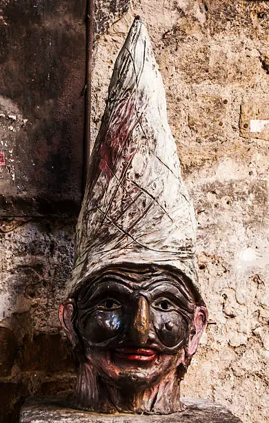 the sculpture of neapolitan mask Pulcinella  in Naples, Italy