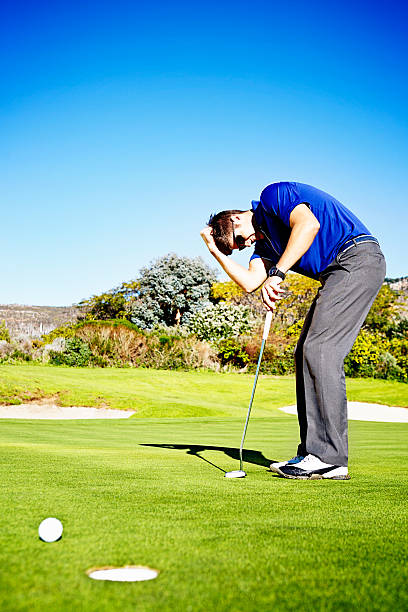 istock Frustrated young golfer misses easy putt 500258775