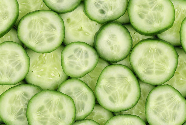 istock Close up of fresh sliced cucumbers. 500260875