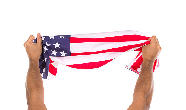 istock Hand holding American flag isolated on white background 500260957
