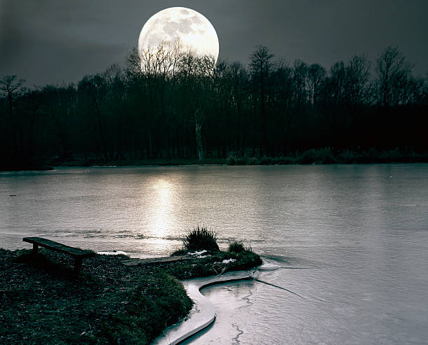 istock Spooky moonrise over lake 500261751