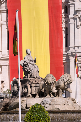 Statue of Cibeles, decorated with the flags of Spain