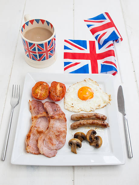 istock cooked english breakfast with british flag and tea 500262441