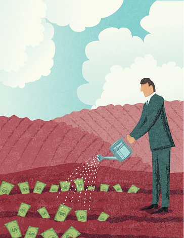 Businessman Watering His Money In The Field. Growth Concept. 