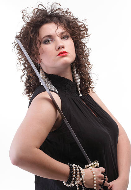 istock piercing woman curly girl and sword 500263630