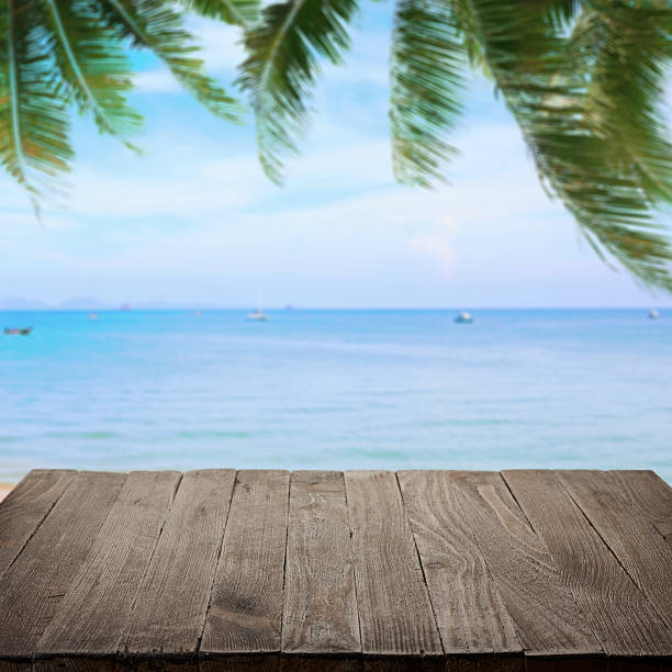 istock Empty wooden table with tropical sea on background 500263886