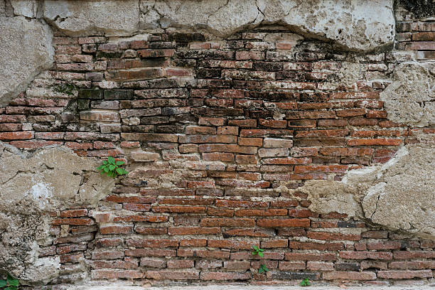 istock cracked concrete vintage brick wall background 500264486