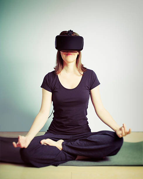 istock Woman Wearing Virtual Reality Headset Doing Yoga Meditation 500264674