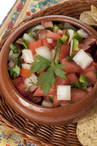 bowl of mexican salsa with chips