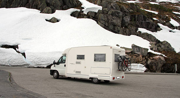 istock Motor home parked near snowy mountain 500275873