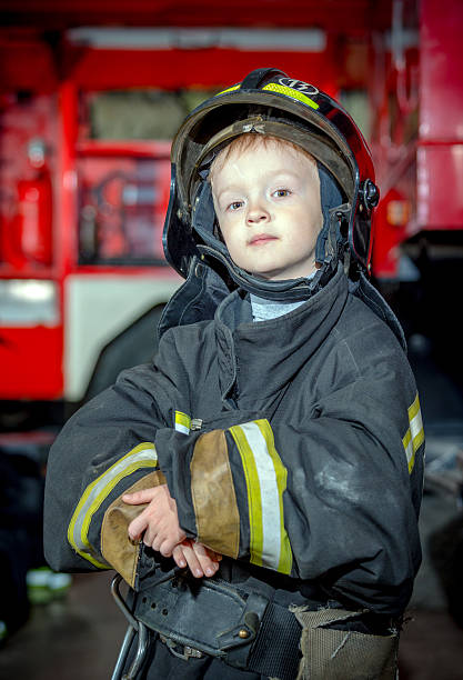istock Portrait of little fireman 500275941