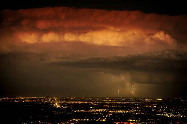 Heavy Storm Above the City Heavy Night Storm Above the City. Denver Metro Area, Colorado, United States. arcada stock pictures, royalty-free photos & images