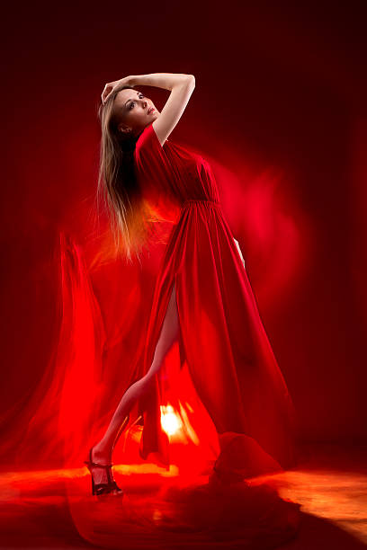 istock Passionate beautiful lady in long red dress 500280973