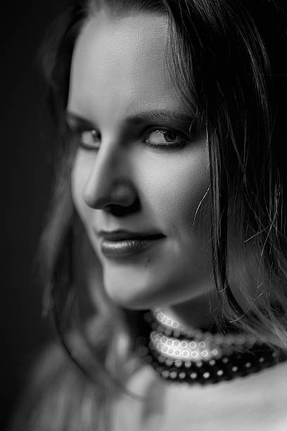 istock young woman with necklace monochrome 500282035