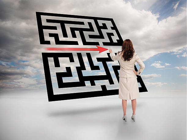 istock Businesswoman drawing red arrow through qr code 500282431