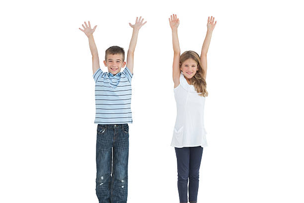 istock Happy young brother and sister cheering 500283227