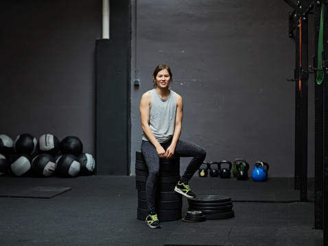 Portrait of gymer smiling at camera in gym