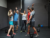 Group of gymters celebrating workout