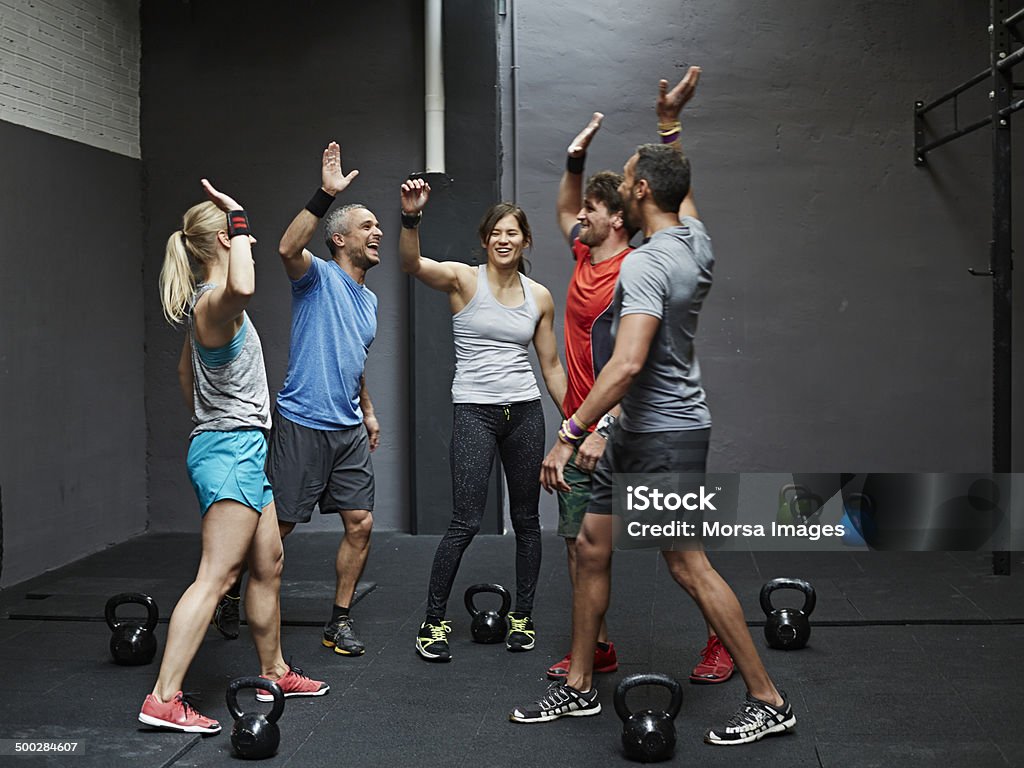 Group of gymters celebrating workout Group of gymters celebrating workout after class Exercising Stock Photo