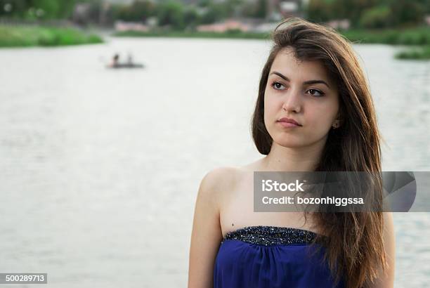 Beautiful Asian Girl Thoughtfully Looks Into Distance Stock Photo - Download Image Now