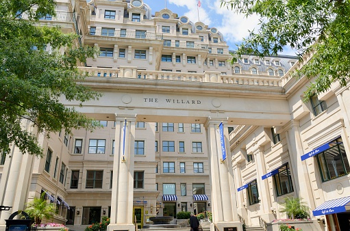 Washington DC, USA - June 4, 2012: The entrance to the Willard InterContinental in downtown Washington DC with a person approaching. Founded in 1847 by Henry Willard, it is a luxury hotel now part of the InterContinental group.