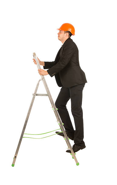 istock Middle Age Male Engineer on Small Steel Ladder 500292070