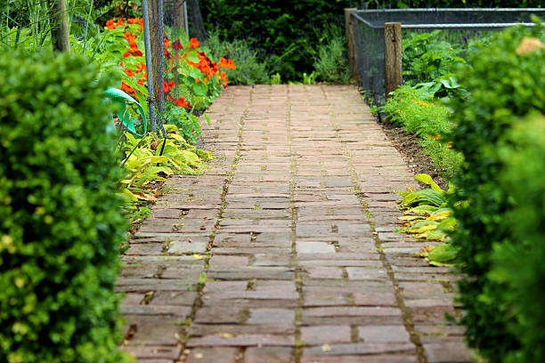 istock Image of old red brick pathway, formal ornamental vegetable garden 500292751
