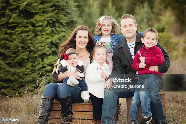 Large Family Christmas Card Photo In Christmas Tree Farm Stock Photo - Download Image Now
