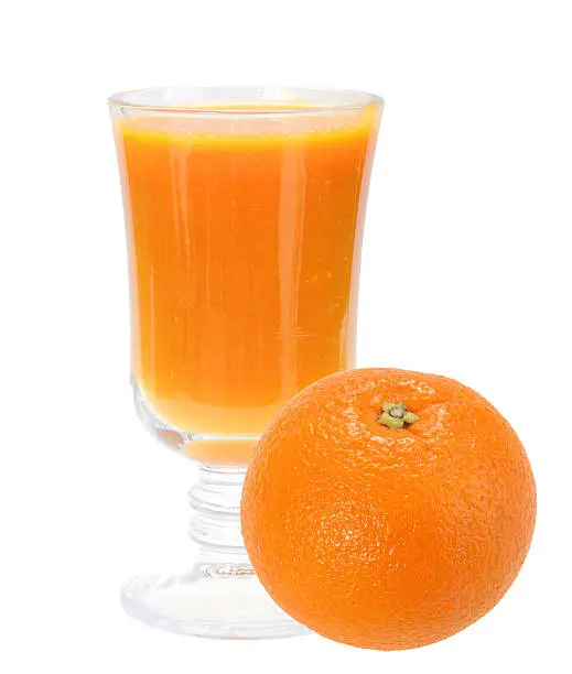 Single glass with fresh orange juice and full orange-fruit. Isolated on white background. Close-up. Studio photography.