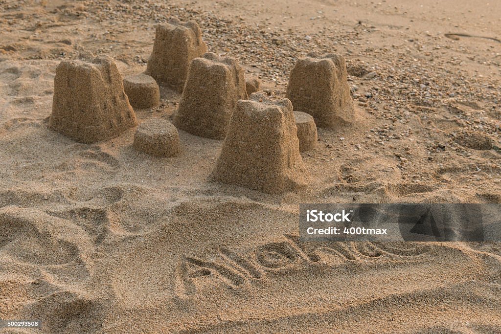 Aloha Aloha and a sand castle on the beach. 2015 Stock Photo