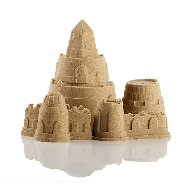 istock Sandcastle at the beach isolated over white 500294441