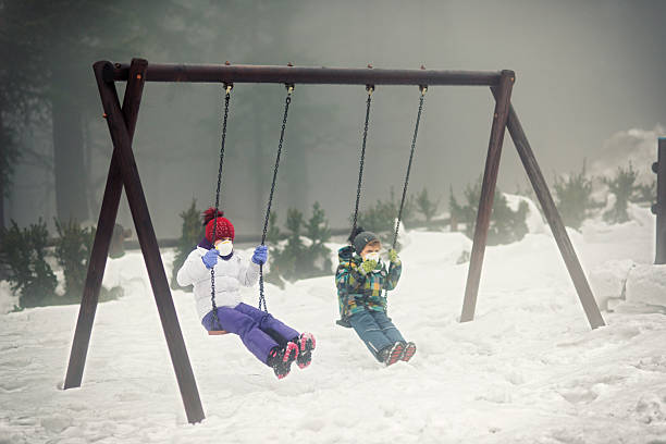 istock Kids playing in garder in polluted air 500294566