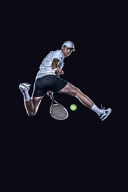 jogador de tênis de chegar para o difícil bola isolada - lighting equipment illuminated isolated on black part of - fotografias e filmes do acervo