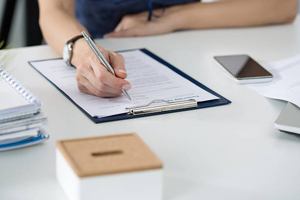 istock Woman writing something sitting at her office 500299000